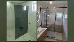 Fiksna stjenka od toniranog stakla i klizna kabina sa crnim profilima, obje postavljene direktno na pločice, iz naših radova